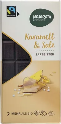 A product shot of a chocolate bar wrapper with an image of chocolate pieces and caramel.