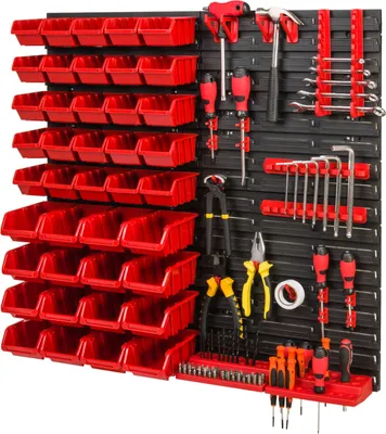 A wall-mounted tool organizer with multiple red storage bins and various tools displayed.