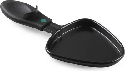 A black raclette pan with a handle is shown against a white background.