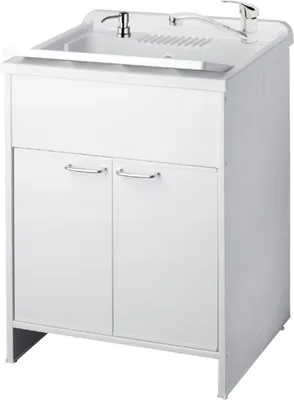 A white sink cabinet with a faucet and soap dispenser.