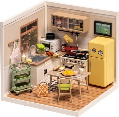 A miniature dollhouse kitchen scene with furniture and accessories.