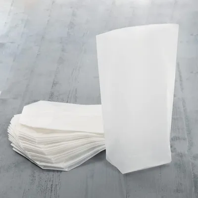 Produktbild von Logbuch-Verlag 100 Kreuzbodenbeutel 14 x 22 x 5,5 cm aus Pergaminpapier - Pergamin Papiertüten leicht transparent - lebensmittelecht100 Stück