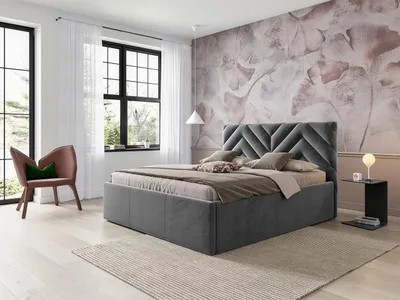 A bedroom scene with a bed, chair, and a window.