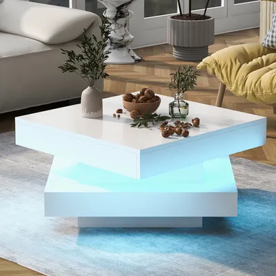 A modern living room with a white coffee table featuring LED lighting.