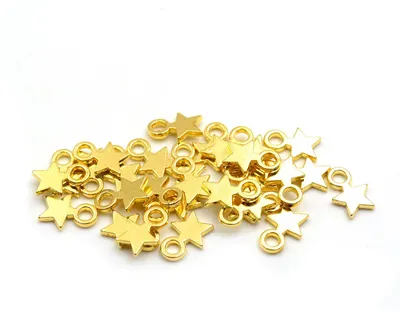 Produktbild von Vintageparts Stern Anhänger goldfarben 12 mm, 30 Stück
