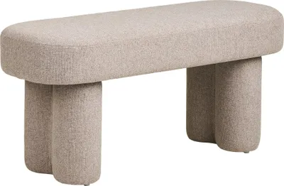 A beige upholstered bench with four cylindrical legs, shown against a white background.