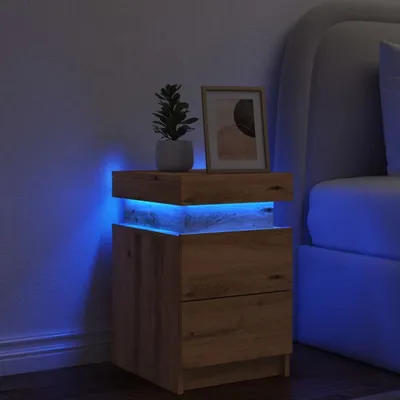 A wooden nightstand with blue LED lighting is placed next to a bed in a dimly lit bedroom.