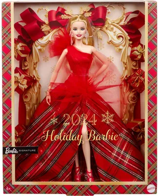 A Barbie doll in a red dress, presented in its holiday-themed packaging.