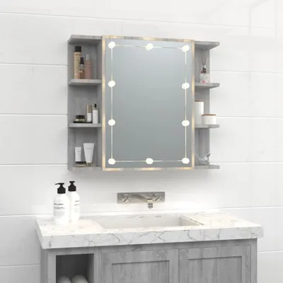 A bathroom vanity with a medicine cabinet with a lighted mirror.