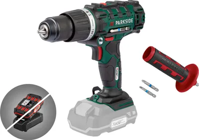 A cordless drill with accessories and a battery charger shown against a white background.