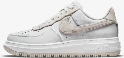A side view of a Nike Air Force 1 Low Luxe sneaker in Summit White and Light Bone.