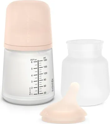 A baby bottle and its accessories are displayed against a white background.
