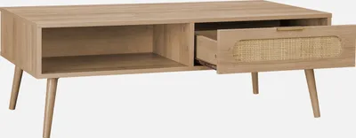 A light brown wooden coffee table with one open drawer and one open shelf, shown against a white background.