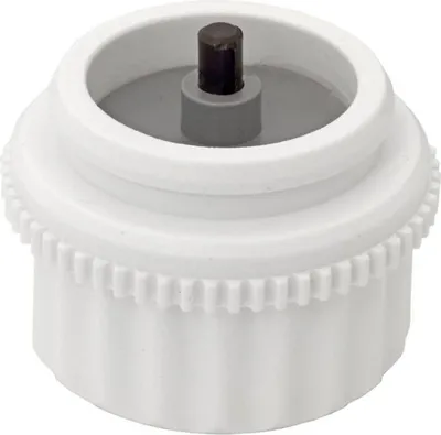 A close-up studio shot of a white plastic vent adapter with a black central pin.
