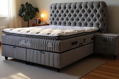 A bedroom scene with a bed and nightstand.