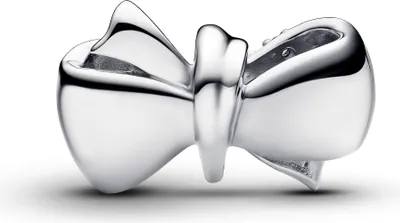 A close-up studio shot of a silver bow-shaped charm.