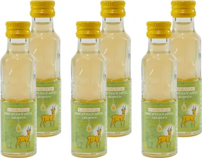 A group of small glass bottles with yellow caps and green labels, each featuring a deer illustration.