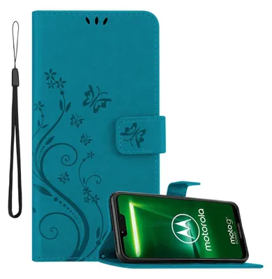 A teal flip case for a Motorola phone is shown open, with the phone inside displaying its screen. A wrist strap is attached to the side of the case.