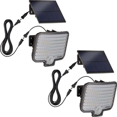 Two solar-powered outdoor spotlights with motion sensors and separate solar panels are shown against a white background.