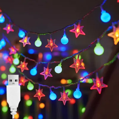 Immagine prodotto di Catena luminosa con stelle e palline, alimentata tramite USB - 3 metri - 20 luci LED - Per uso interno - Adatta per Natale e per le festività - Decorazione natalizia