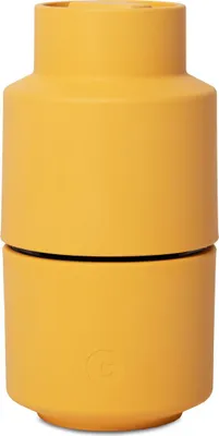 A yellow spice grinder.