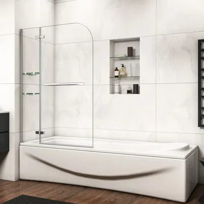 A modern bathroom with a bathtub and a glass shower screen.