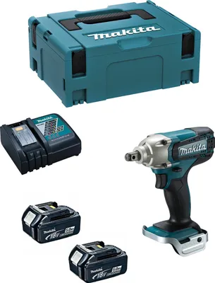 A product shot of a Makita impact wrench kit, including the tool, two batteries, a charger, and a storage case.
