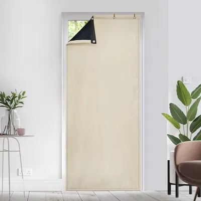 A cream-colored thermal curtain is hung over a door, with a small section of black material visible at the top left corner.