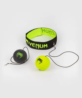 A boxing reflex ball set with a headband and two balls on a white background.