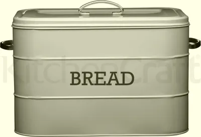 A cream-colored metal bread bin with the word "BREAD" printed on the front.