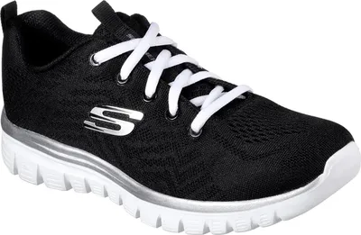A studio shot of a single black Skechers shoe with white laces and a silver accent.