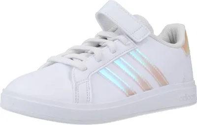 A white Adidas sneaker with iridescent stripes.