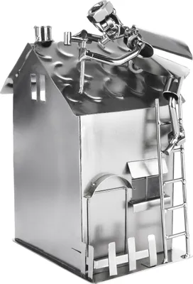A metal figurine of a house with a roofer working on the roof.