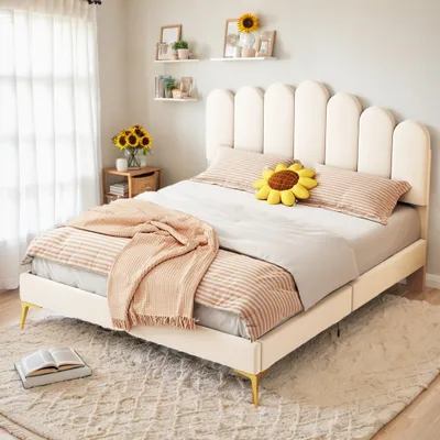 A bedroom scene featuring a bed with bedding and decorative items.