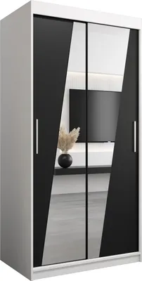 A modern wardrobe with sliding doors and mirrored panels.