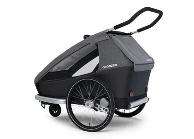 A child trailer for bicycles is shown against a white background.