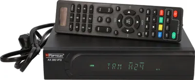 A black digital satellite receiver with a remote control on top, set against a white background.