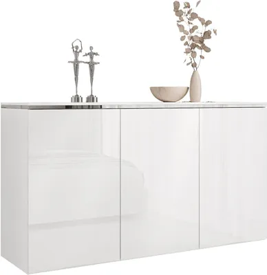 A white, modern sideboard with decorative items on top.