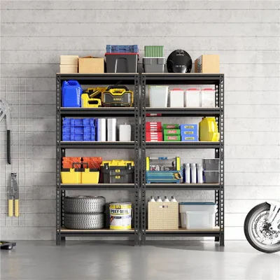 Two black metal shelving units filled with various items like tools, containers, tires, and a helmet, in a garage or workshop setting.