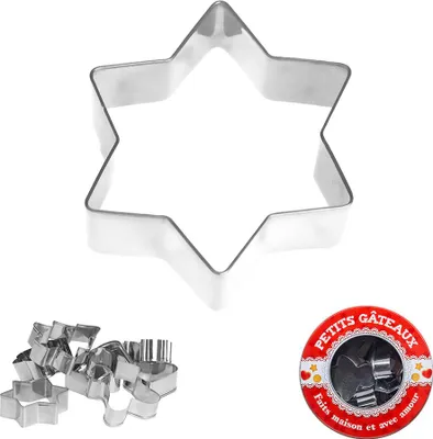 A collection of star-shaped cookie cutters and a tin of cookie cutters.