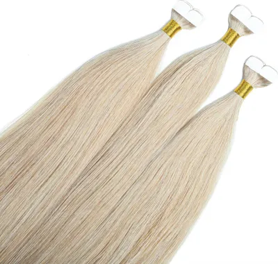 Three bundles of blonde hair extensions are laid out diagonally on a white background.