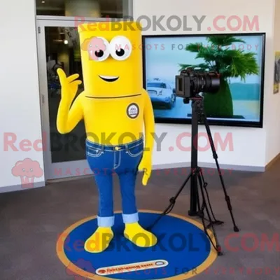 Immagine prodotto di Personaggio in costume mascotte REDBROKOLY fotocamera gialla vestito con jeans bootcut e fermacravatta