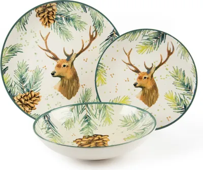 A set of ceramic tableware with a deer and pine branch motif.
