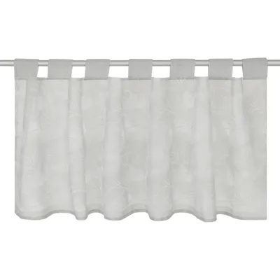 A white bistro curtain with a subtle leaf pattern hanging from a curtain rod.