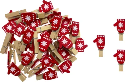 A pile of red and white mitten-shaped clothespins on a white background, with a few scattered to the right.