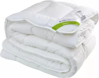 A folded white comforter is shown against a white background.