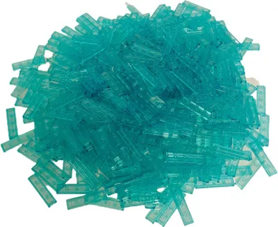 A pile of small, translucent blue LEGO tiles.