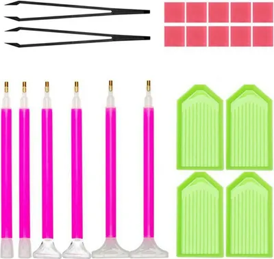 A collection of diamond painting accessories laid out on a white background.