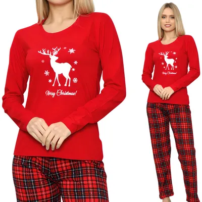 A woman wearing red Christmas pajamas with a reindeer print and plaid pants.