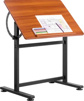 A drafting table with a drawing and colored pencils on its surface.